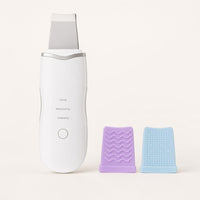 Limpiador facial ultrasónico Nuzevo blanco con dos fundas de silicona