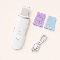 Contenido del limpiador facial ultrasónico blanco: aparato, dos fundas de silicona y cable USB